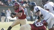 Tailback Paul Stanton Jr. ran for two touchdowns, the first one on an eight-yard burst in the final minute of the opening half. Tackle Cole Toner helped clear the way with a block on Penn linebacker David Park (54).   