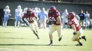 Convoyed by fellow linebackers Dominique Packer ’17 (number 40) and Connor Sheehan ’15 (50),  Matt Koran ’16  took this first-quarter interception for a touchdown, one of the Crimson's record-setting three runbacks for scores. Koran's pick-six was sandwiched between a pair by Sheehan. 