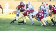 Not going anywhere? Columbia's Turner DeMuth ran into a posse of Harvard tacklers, including linebacker Eric Medes ’16 (number 49), defensive back Scott Peters ’16 (44), defensive back Jordan Becerra ’16 (31) and linebacker Chase Guillory ’18 (45).