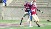 On a late Columbia offensive foray, Lions receiver Ben Kaplan found himself in the middle of hard-hitting double coverage by Crimson defensive back Asante Gibson ’16 (number 22) and linebacker Eric Ryan ’17. Ryan also had a fumble return and led the Crimson with 10 tackles. 