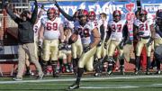 With nary a Quaker in sight and the Harvard bench cheering him on, Paul Stanton Jr. ’16 cruised goalward on his 75-yard, second-period touchdown dash. The score, already Stanton’s second of the game, gave the Crimson a 14-10 lead.