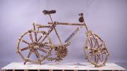 <i>Bicicleta rural/Rural Bicycle</i>, an eight-foot-tall wood and rope sculpture by Mozambique artist Titos Mabota, towers over the final room of the Cooper Gallery exhibit.