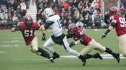 As so often happened this season, an opposing quarterback—in this case, Yale’s Morgan Roberts—had nowhere to run against marauding Crimson defenders such as linebackers Jake Lindsey ’16 (number 51) and Eric Medes ’16 (number 49), who were helped by defensive tackle Miles McCollum ’17.