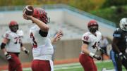 Senior special: Quarterback Scott Hosch threw to tight end Ben Braunecker (48), who caught the ball in stride and took it 53 yards for Harvard's first score.