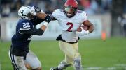 Seitu Smith II fended off Yale's Hayden Carlson. The senior Smith and his sophomore brother, Semar, shared the running-back duties and totaled 106 often-tough yards.