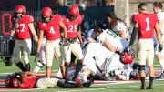 Dartmouth players jubilantly pile on Masaki Aerts after a last-second victory.
