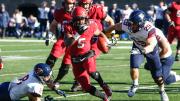 Harvard wideout B.J. Watson runs upfield, ball in hand.