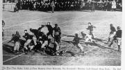 A ball flies through the air off the foot of Vic Kennard.