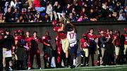 Harvard receiver Ledger Hatch catches the ball over Penn's Jason McCleod.