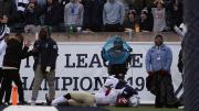 Kym Wimberly holds the ball as a Yale defender tries to peel it from his hands.