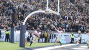 Harvard celebrates a touchdown in the endzone.