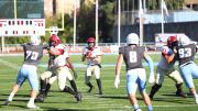 Quarterback Luke Emge takes the snap and looks upfield.