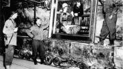 At the Merkers salt mines in central Germany, American GIs admire Édouard Manet’s <em>In the Conservatory,</em> one of the thousands of rare works and documents stored there by the Nazi regime late in World War II. Monuments Man George Stout (see next image), a Fogg Museum conservator turned U.S. Army lieutenant, supervised the rescue of 40 tons of art from the site in April 1945.