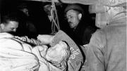 Stout (center) and Steven Kovalyak (far left) supervise the removal of Michelangelo’s <em>Bruges Madonna</em> from the salt mine at Altaussee, Austria.