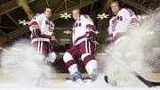 Hard-skating brothers Danny, Alex, and Michael Biega (left to right) spray ice chips at Bright Hockey Center.