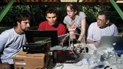 Bernardo Flores, Rafael  Tapajós, and Hannah Horowitz ’11 learn how to analyze data  gathered from a weather balloon under the supervision of  Professor Steven Wofsy