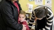 In Dorchester, Liam Denver has a hard time saying goodbye to his mother, Kim, as teacher Carolyn Christopher offers comfort.