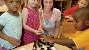 Teacher Meghan McDonough plays with preschoolers.