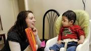 The social workers are concerned with child development, broadly defined: they recognize that professional and personal fulfillment supports maternal mental health. During the same visit, social worker Sarah McLanahan plays with Miguel.