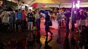 Harvard Yard had more standing water than solid ground, and partygoers gathered under the food tents to stay dry during downpours.
