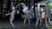 While most revelers fought to keep their feet dry, some embraced the mud.