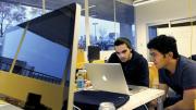 Gal Koren (left) and Tuan Ho at work in the lab