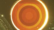 This disortion-free flat lens, less than a millimeter across, uses antennae etched from a layer of gold, rather than glass, to focus laser light. 