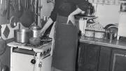 Child in her postwar Paris kitchen