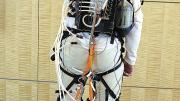The actuator box, carried in the wearer's backpack, provides well-timed bursts of power that are transmitted to exosuit components strapped at the user's knee and ankle joints.