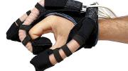 A soft robotic glove intended for hand rehabilitation therapy uses fluid-powered elastic tubes to mimic finger movements. 