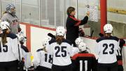 Katey Stone diagrams a play for her athletes. 