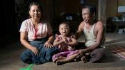Photograph © Tim Mitzman for Proximity Designs 2013 U Myat Thein, an entrepreneurial farmer and now a village agent for Proximity Designs, grows corn as a cash crop in Wakouktaw village, Kungyangon township; with his wife, Daw Khin Ohn Myint, and their youngest child, daughter Thin Thin Myat, he welcomes visitors to their home—fans at the ready for the delta's heat and humidity.
