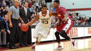 Senior Wesley Saunders (shown here, driving to the basket) led Harvard to victory with a game-high 27 points.