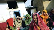 Vyasa Devi, foreground, mourning at the wake for her daughter, Meera, who died&mdash;by murder or suicide&mdash;in a marriage filled with physical abuse and demands for more dowry payments. Himachal Pradesh, December 2006.