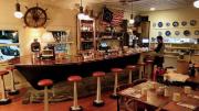 Photograph showing a restaurant bar made from a vintage dory