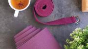 Yoga map, yoga strap, and cup of tea