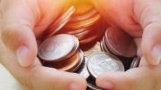 Hands holding coins