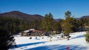 Snowy view of Berkshire East's warming lodges and restaurant