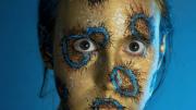Shelby Meyerhoff's photographic self-portrait of her head and shoulders transformed with body paints into a blue-ringed octopus