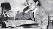 Archival photograph of John F. Kennedy as an undergraduate, circa 1939, studying papers