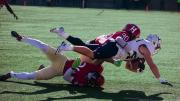  Harvard’s Truman Jones (90) and Khalil Dawsey corral Yale running back Joshua Pitsenberger. 