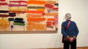 A guest ponders Joan Snyder’s <em>Summer Orange</em>, 1970