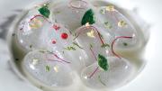 This dish from the elBulli kitchen, "spherical balloons of rosewater with touches of lychee," uses Adrià's trademark spherification technique.