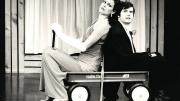 Sigourney Weaver and Durang in their 1979-80 Brecht-Weill cabaret act, <em>Das Lusitania Songspiel</em>. They entered in a red wagon, parodying the opening of the Brecht-Weill opera <em>The Rise and Fall of the City of Mahagonny,</em> in which American capitalists enter in a wagon on a search for gold. 