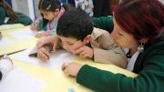 A teacher and student work together on a writing exercise. Chilean schools typically don't begin to teach reading until the first grade; UBC gives teachers strategies for introducing the alphabet and building early literacy with four- and five-year-olds.