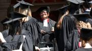 The Reverend Peter J. Gomes with graduating seniors outside the Memorial Church
