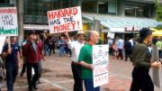 Students and workers protested layoffs on June 25, in a march that began in Harvard Yard and proceeded to Holyoke Center.