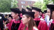 Unidentified professional school grads march bravely into the future