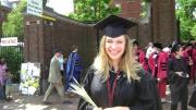 Unidentified 2010 graduate holds a symbolic sheaf of wheat. 
