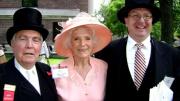 Unidentified member of the "Happy Observance of Commencement Committee" (left) ensures that Betty Brec and unidentified usher enjoy the 2010 Commencement alumni/ae parade.